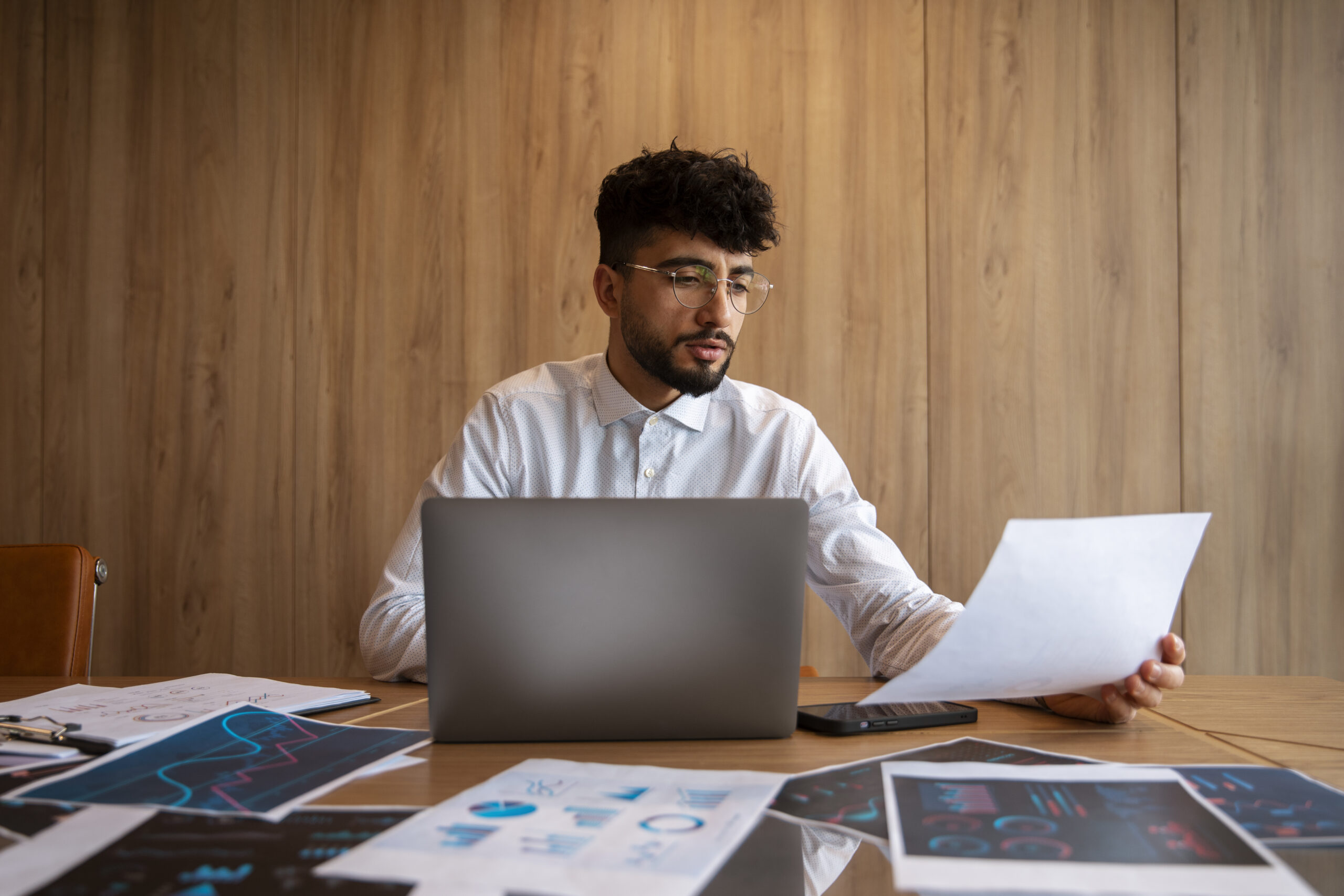office worker using finance graphs scaled